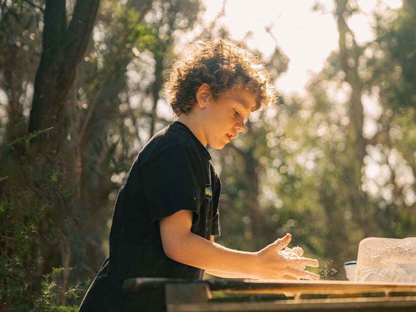Child making food with hands