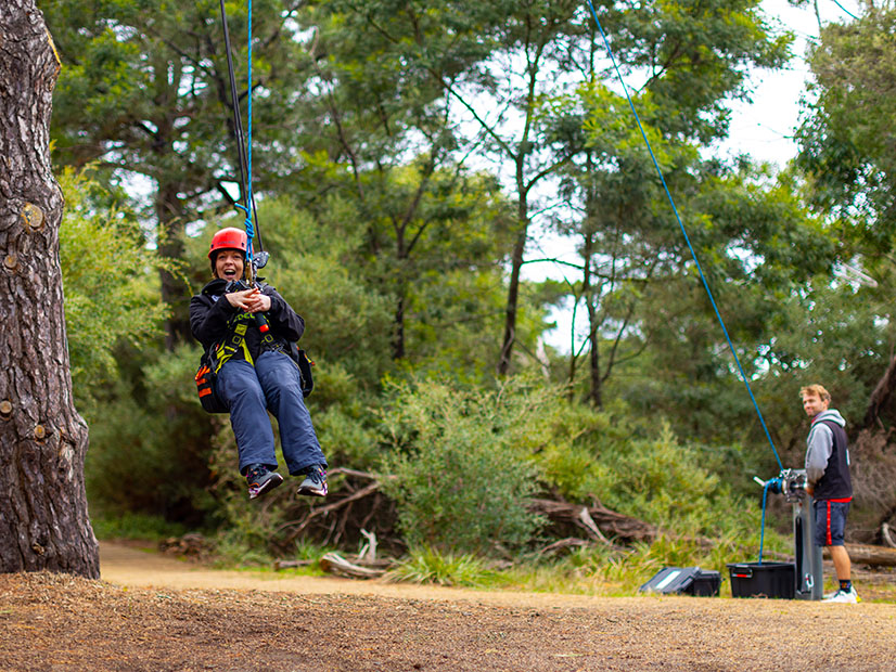 Young person on the flying fox at Camp Manyung