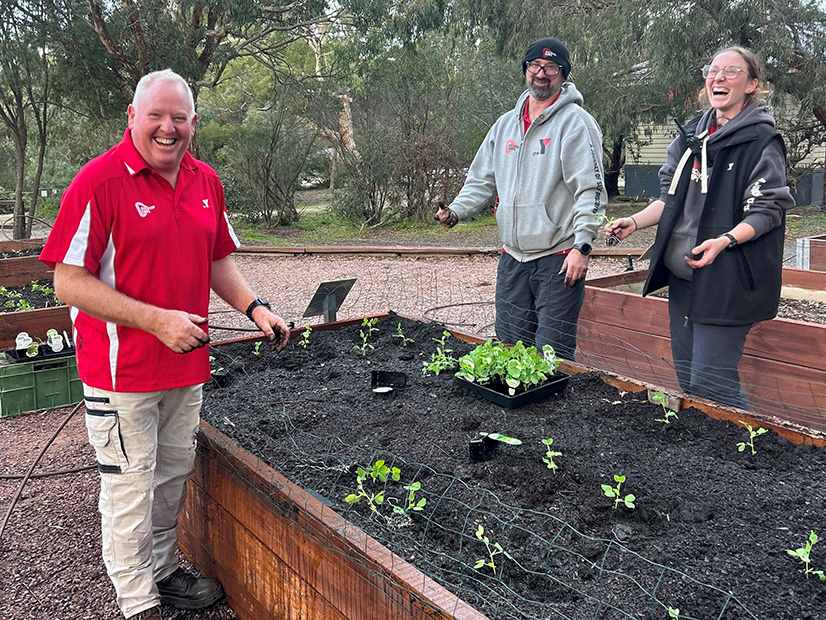Lady Northcote Manager Matt Dyer smiling while gardening with the team