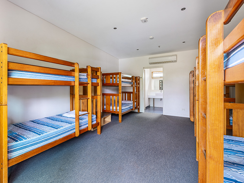 Bedroom with multiple bunk beds at Lake Dewar Discovery Camp